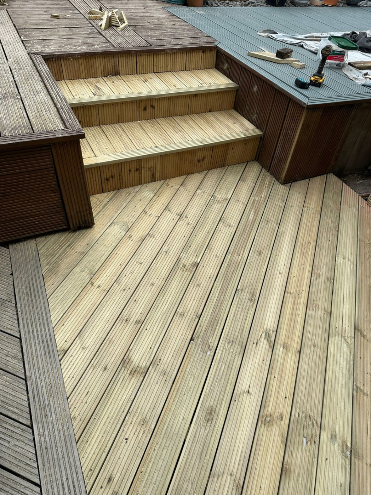 Fresh timber decking with steps installed in a Nottinghamshire garden by Sherwood